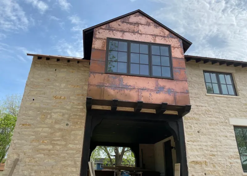 Copper metal panel facade on a stone building for Roof Repair in Gold Canyon